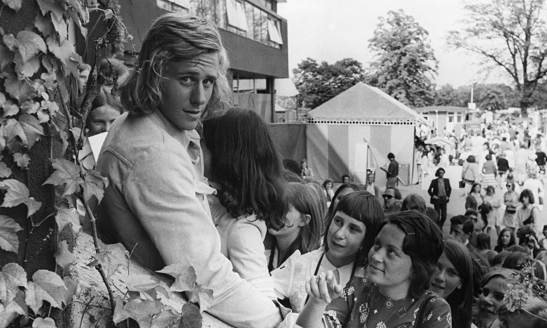 Seventeen-year-old Swedish tennis player Björn Borg signs autographs for fans during the Wimbledon Championships in London, June 1973.