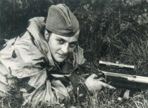 Soviet sniper Lyudmila Pavlichenko lying in a firing position with her rifle near Sevastopol, photographed during the Second World War on June 6, 1942.