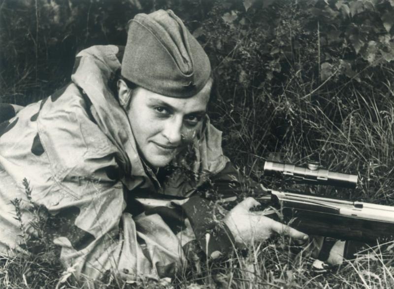 Soviet sniper Lyudmila Pavlichenko lying in a firing position with her rifle near Sevastopol, photographed during the Second World War on June 6, 1942.