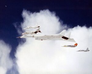 The experimental XB-70 Valkyrie bomber flies in formation with several aircraft during a promotional photo flight shortly before a fatal mid-air collision in California on June 8, 1966.